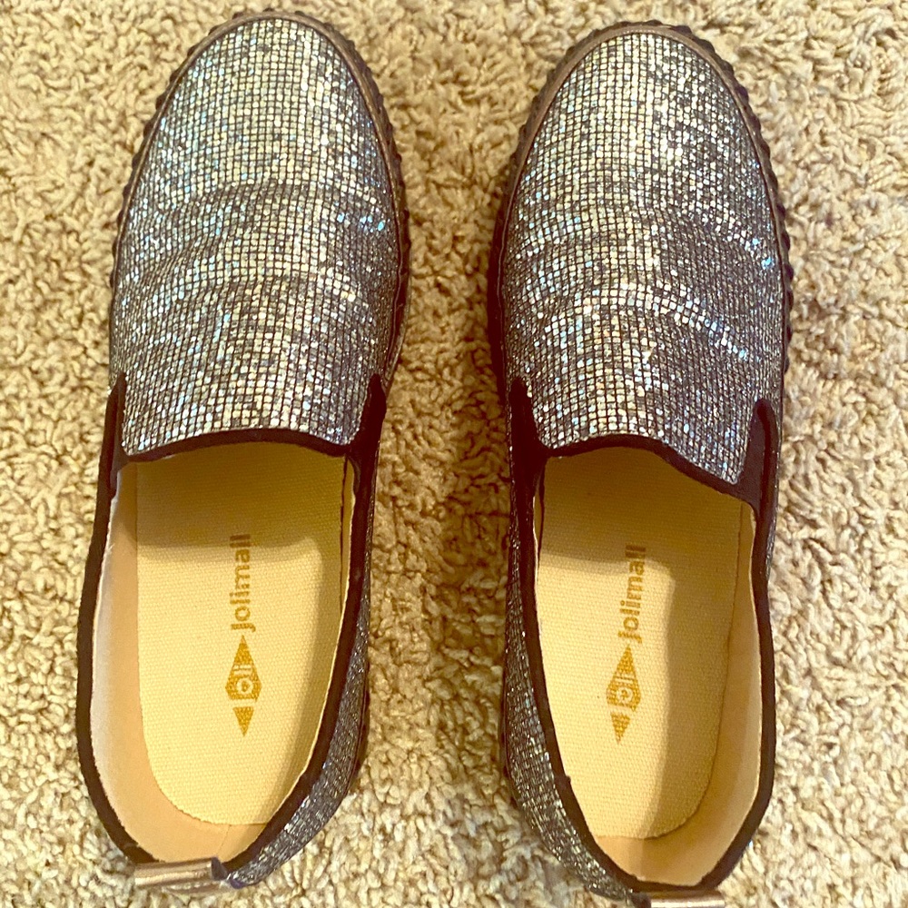 Black sparkle flat shoes.